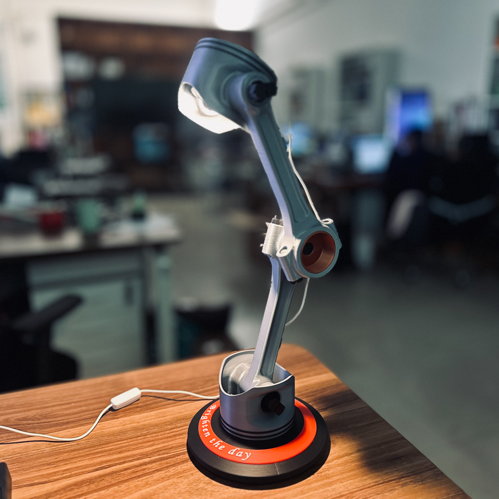 Robotic arm on a desk with a blurred office background