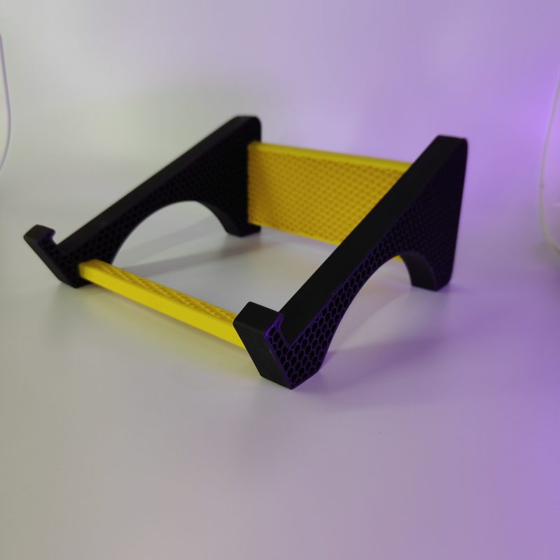 Black and yellow laptop stand, side view