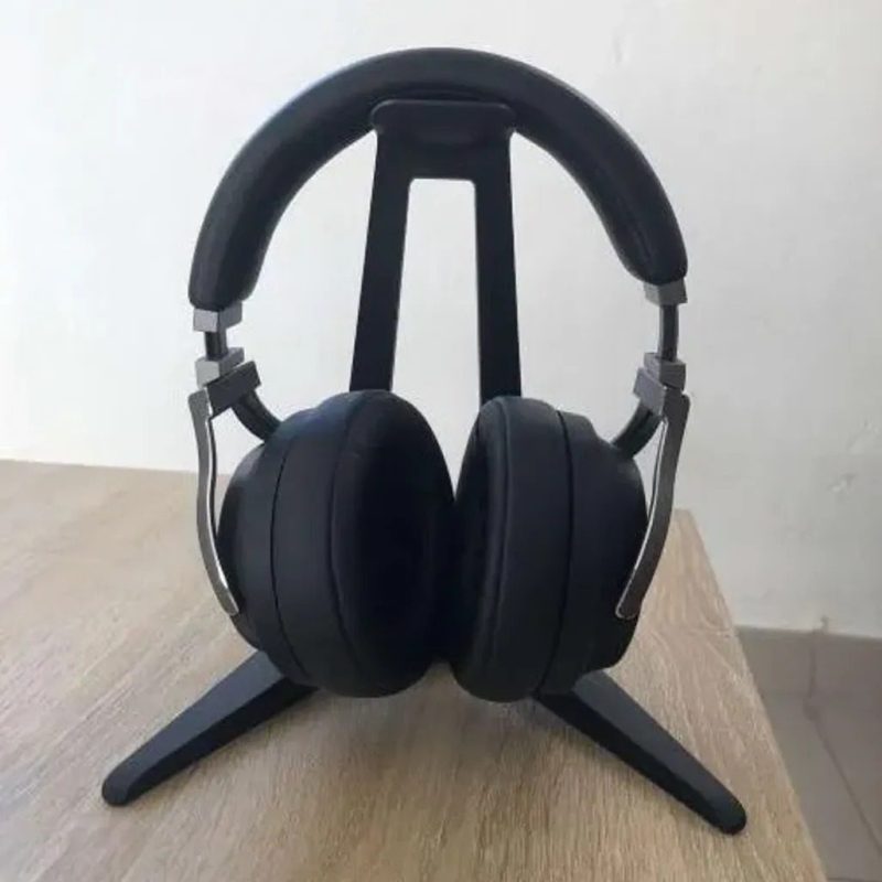 Black headphone stand holding a pair of headphones